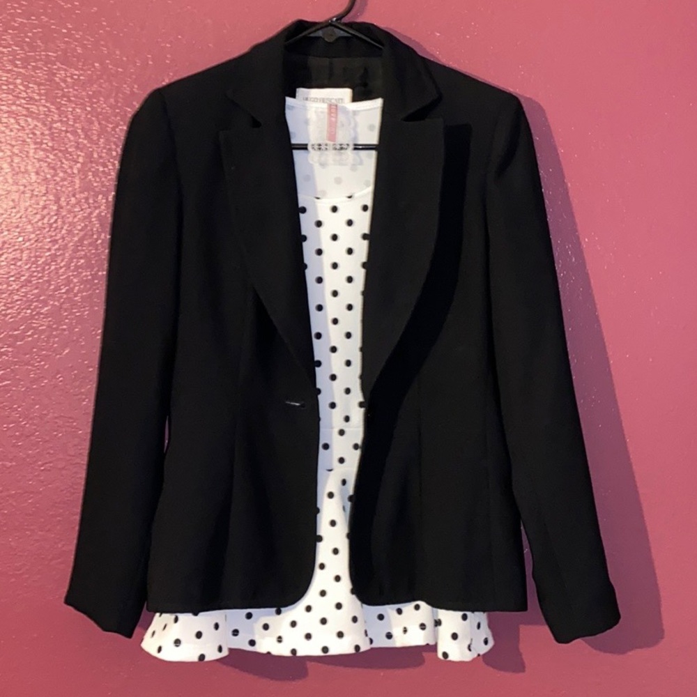 White and black polkadot shirt